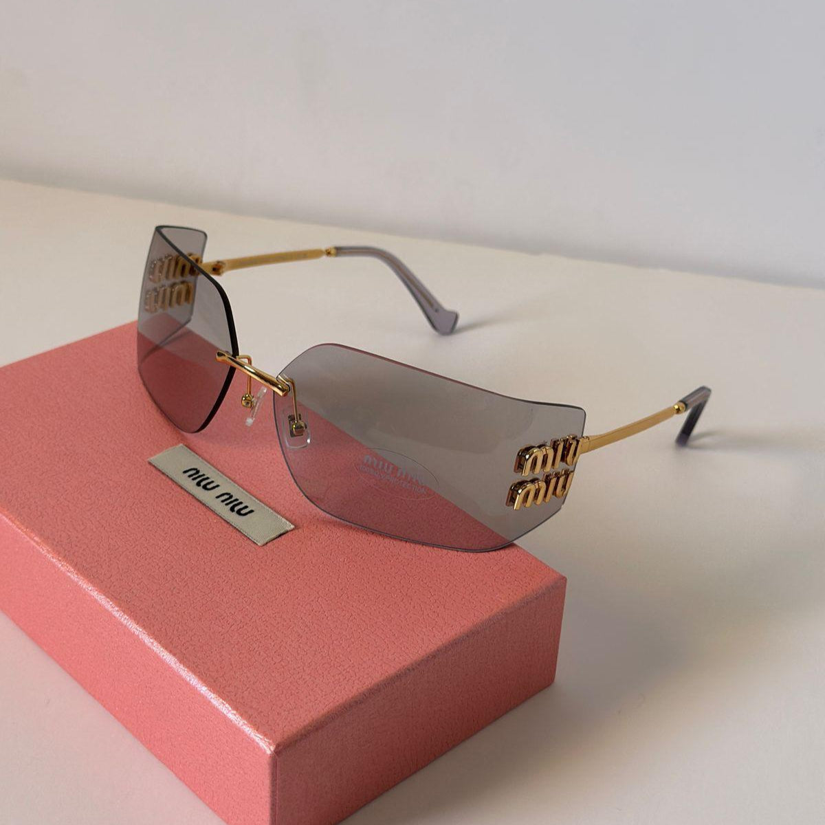 Miu Miu MU 10WS Rimless Shield Sunglasses - Sassygrove